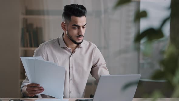 Serious Arabian Young Business Guy Male Professional Worker Employee Type on Computer Keyboard Copy