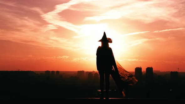 Girl Standing in a Witch Costume Halloween Outdoors Concept