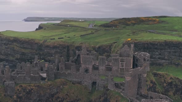 Dunluce Castle ruins on the Antrim Coast, Northern Ireland. Aerial drone view