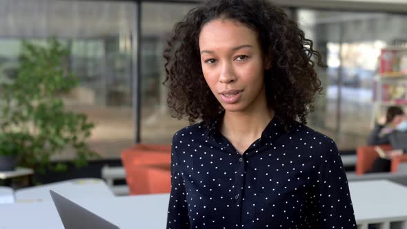 Portrait of Curly Attractive Positive African American Girl Pleasant Young Business Woman Student or