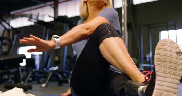 Senior Woman Stretching in Fitness Studio 4k