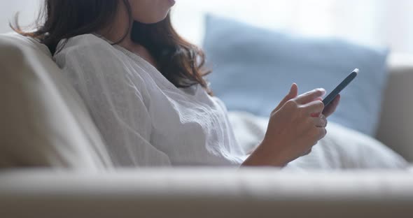 Asian Woman Use of Smart Phone at Home