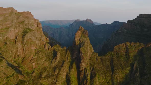 View of dramatic central mountains of Madeira at sunrise; aerial