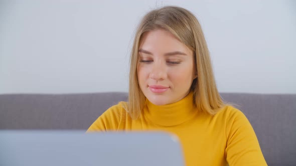 Blonde woman working freelance from home on lockdown in 4k video