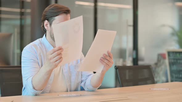 Man Reading Documents