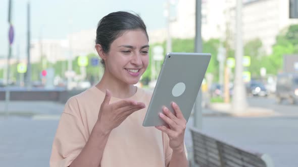 Portrait of Video Call on Tablet By Indian Woman in Office