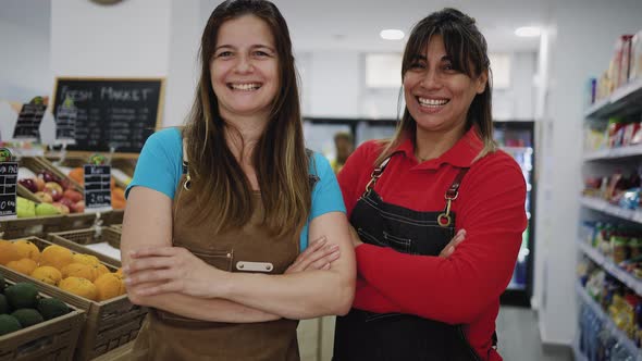 Happy women working inside supermarket