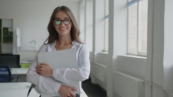 Close Up View of Lady in Office in Red Glasses