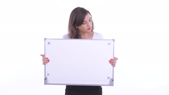 Happy Beautiful Businesswoman Talking While Holding White Board