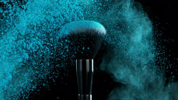 Super Slow Motion Shot of Makeup Brush and Blue Powder Shake at 1000 Fps