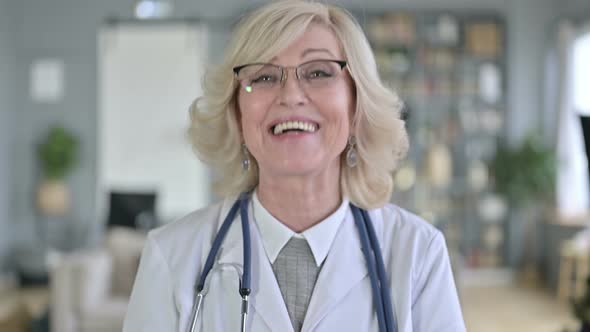 Portrait of Old Female Doctor Doing Video Chat