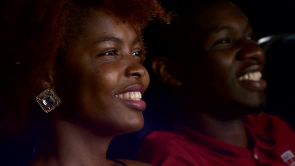 Happy African American Couple, Watching Movie In Theatre, Close Up