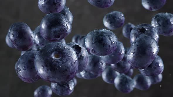 Flying of Blueberries in Dark Kitchen Background