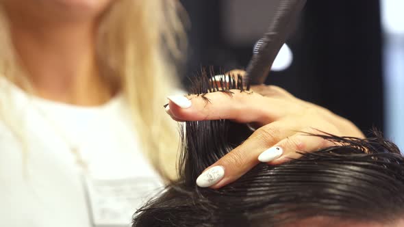 Professional Barber Cut Hair of His Client with Thinning Scissors Cut Out