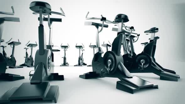 Gym equipment stationary bikes standing in the circular array. Loopable. HD