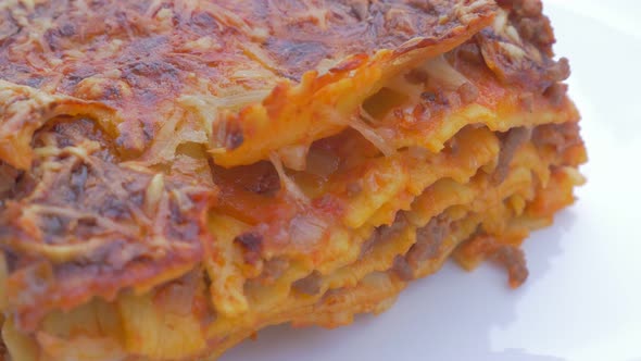 Lasagne on plate  traditional Italian cusine food 4K 2160p UHD panning   footage  - Lasagne food on 