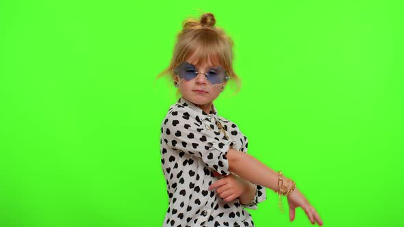 Portrait of Funny Playful Blonde Child Girl in White Black Shirt Wearing Sunglasses Charming Smile