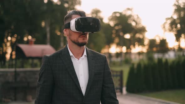 Succesful Bearded Businessman with Virtual Reality Headset Outdoor