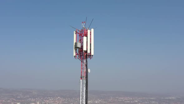 High telecommunication tower against blue sky drone 4K footage