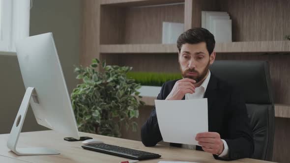 Handsome Entepreneur Angry Frustrated and Unhappy with the Results in Front of the Computer Screen