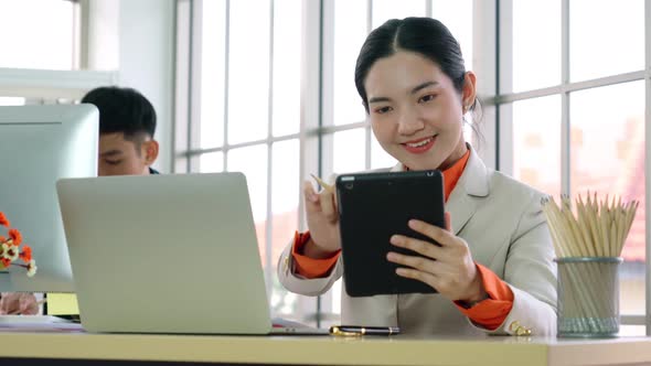 Business People Working at Table in Modern Office