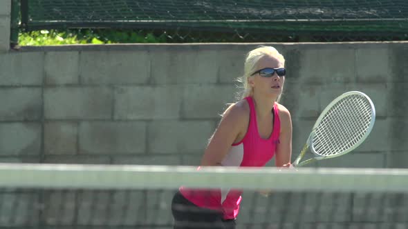 Women playing tennis.