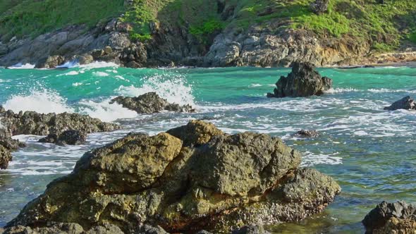 Slow Motion Video The Waves Hit The Rocks Along Yanui Beach.