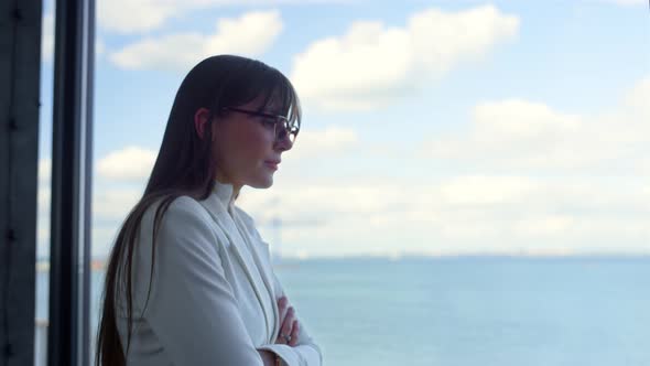 Disappointed Woman Thinking Window in Suit Closeup