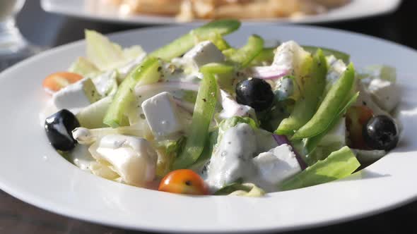 Close Up of Greek Salad in a Bowl on Table.