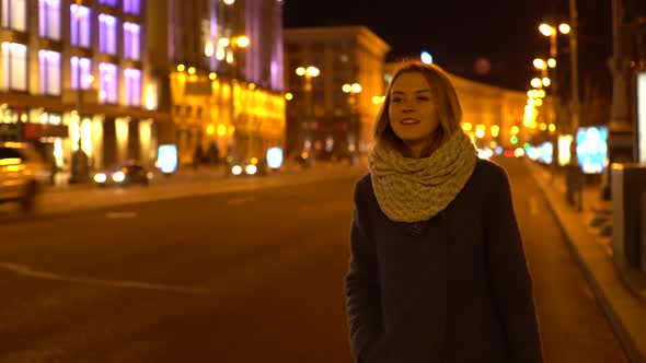 Beautiful Girls at Night Waits and Stops Taxi