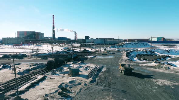 Machines are Driving Through the Premises of a Metallurgical Factory