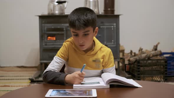 Boy Speaking to Online Teacher