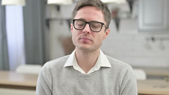 Upset Young Man Crying at the Camera