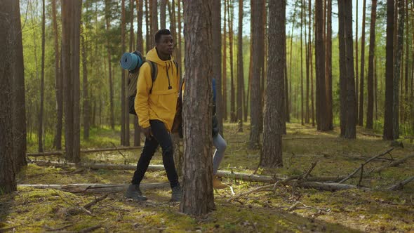 Black Couple Holdings Hands Walking Towards Lake