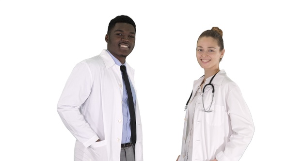 Two caucasian and afro american smiling doctors standing