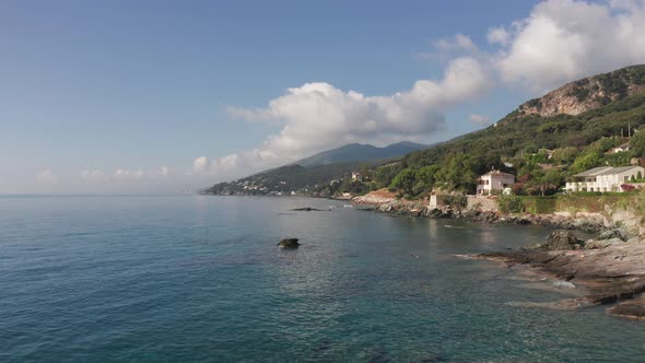 Aerial View of Characteristic Houses on Coastline of Corsica in a Summer Sunny Day