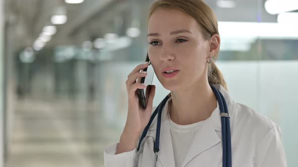 Portrait of Female Doctor Doing Talking on Smartphone