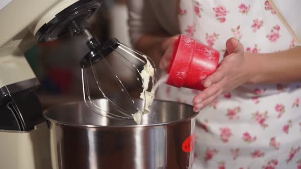 Chef's Hand, Who Mixes the Flour with the Other Ingredients in the Mixer