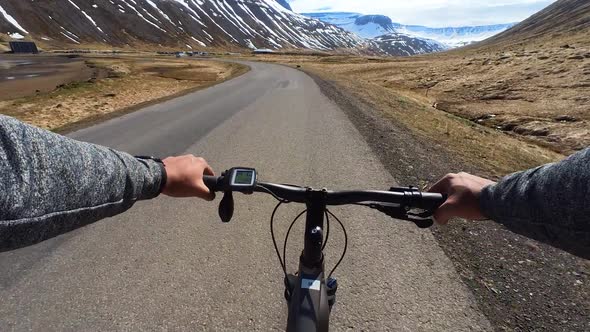 A person is riding bicycle in Iceland