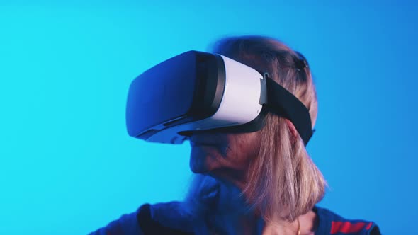 Old Greyhaired Woman Using VR Headset