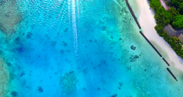 Beautiful aerial clean view of a summer white paradise sand beach and aqua blue ocean background in 