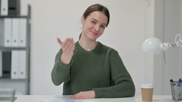 Young Woman Pointing at the Camera 