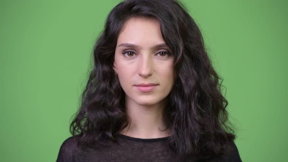 Young Beautiful Woman Against Green Background