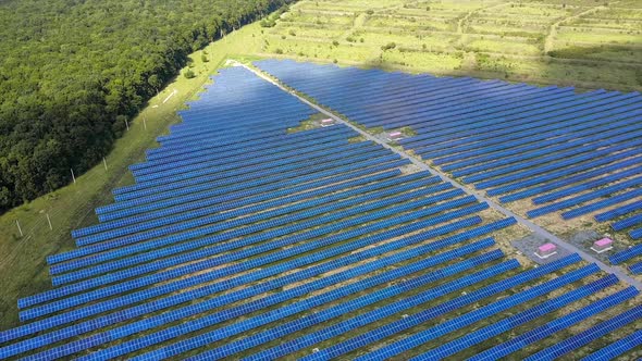 Solar Energy Panels In Field. Solar battery power plant on green meadow