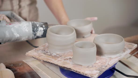 Ceramist Working with Pottery in Workshop.