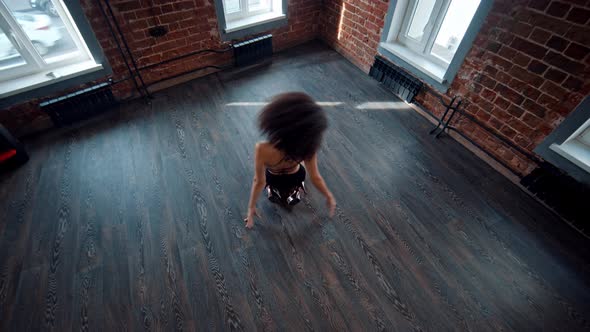 Strip Dancing in the Studio with Dark Floor - Young Woman Dancing on the Floor Wearing High Heels