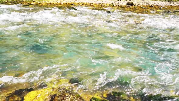 Video of a Mountain River with Blue or Turquoise Water. Slow Motion