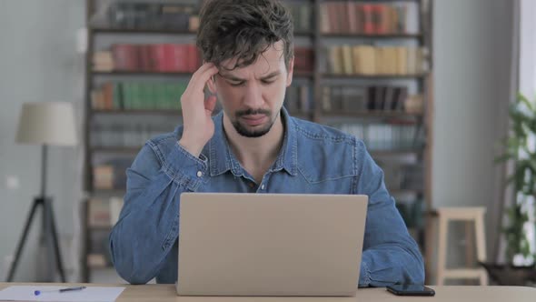 Headache Man in Tension Working in Office Pain