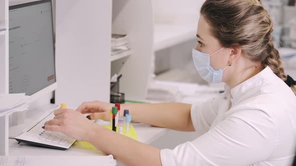 Doctor Working with Computer in a Clinic