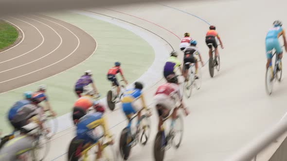 Cycling track pursuit race championship. Cyclists on racing track in velodrome.